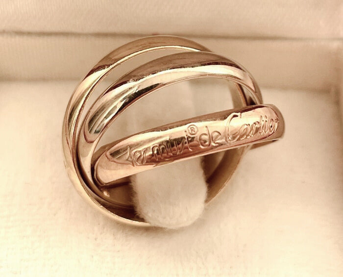 Bague Trinity “Must de Cartier” en or jaune, blanc et rose 18 carats